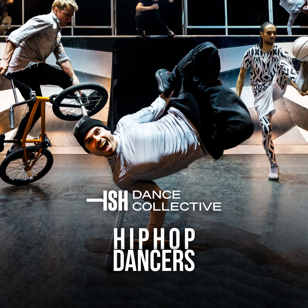 ISH Dance Collective performers on stage: a breaker in a one-hand freeze up front, with a BMX rider, a football freestyler, inline skaters and freerunners on a ramp behind.