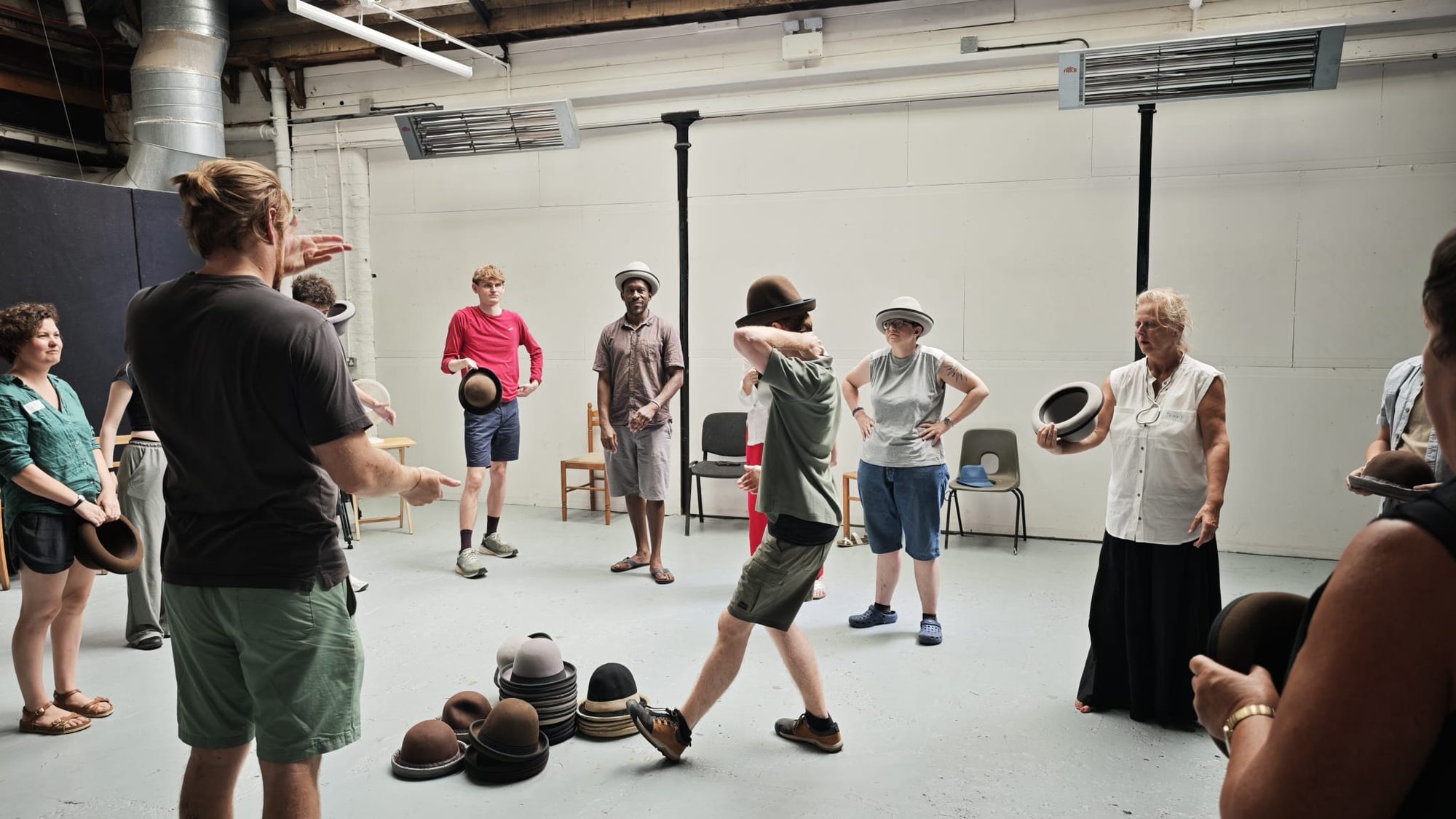 Artists and circus professionals gathered in a creation space during a research lab